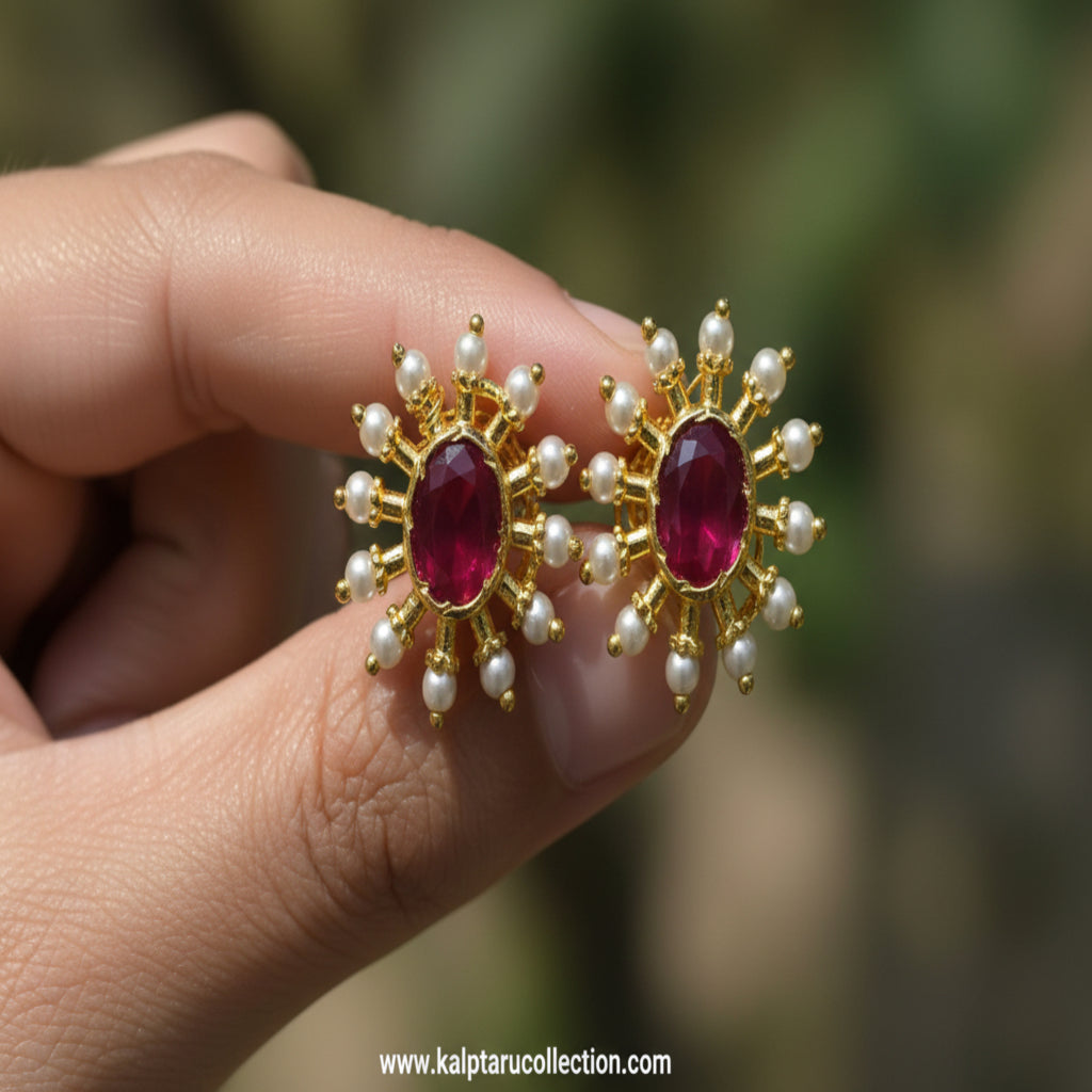 Ruby pearl oval sunburst stud earrings by Kalptaru Collection