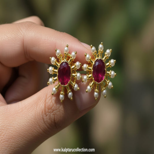 Ruby pearl oval sunburst stud earrings by Kalptaru Collection
