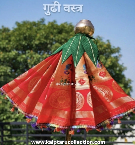 Red Paithani Brocade Gudhi Vastra with Green Mango Leaves by Kalptaru Collection for Gudhi Padwa Festival.