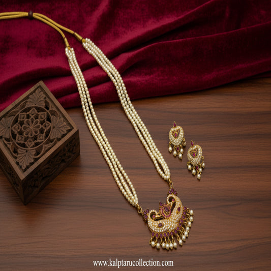Tanmani pearl necklace set with ruby pendant and earrings online by Kalptaru Collection